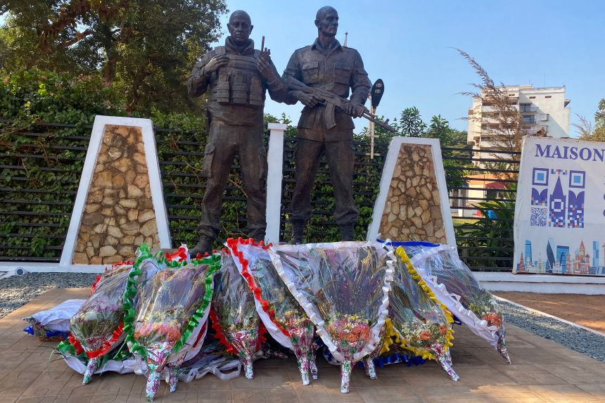 A photograph from 2024 shows a bronze statue depicting Wagner group chief Yevgeny Prigozhin (L) and commander Dmitry Utkin in front of the "Maison Russe" (Russian House) in Bangui, CAR.