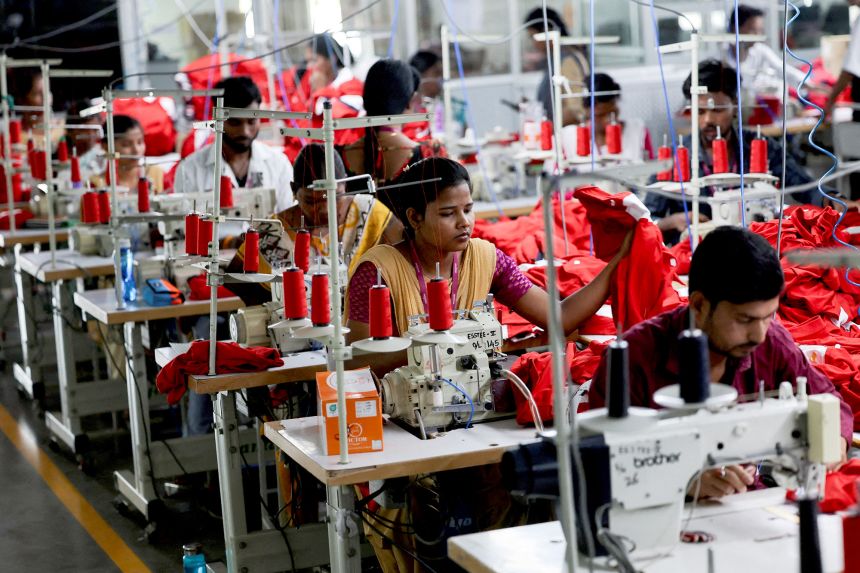 People work at a garment factory in Tiruppur in the southern state of Tamil Nadu, India, on April 23, 2025.