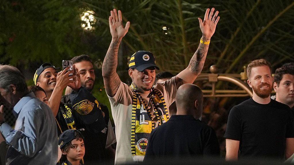 Ederson waves to Fenerbahce fans after arriving in Istanbul to complete his move from Manchester City